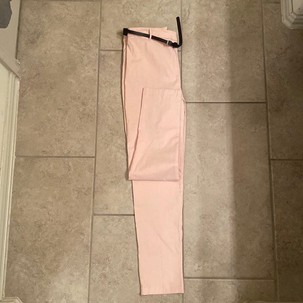 Pink cropped pants with black belt
